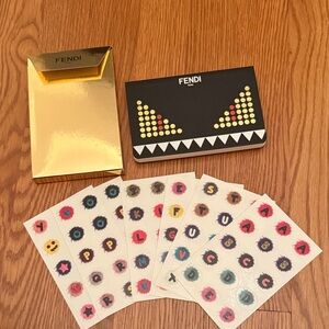Fendi notebook with set of stickers.